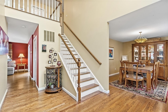 26 Garrity Blvd, Brewster, NY 10509 - stairway featuring baseboards, visible vents, and wood finished floors