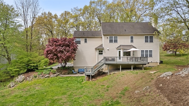 26 Garrity Blvd, Brewster, NY 10509 - rear view of property with a yard, stairway, a chimney, and a wooden deck