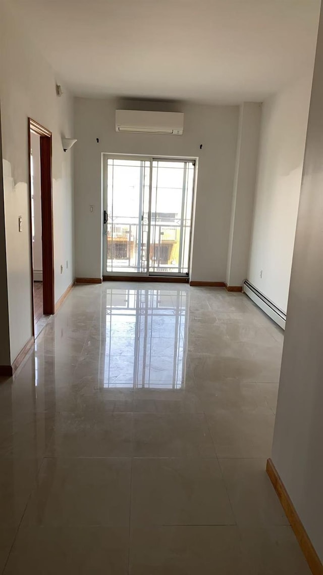 35-19 Leavitt Unit 5H, Flushing, NY 11354 - unfurnished room featuring baseboard heating, a wall unit AC, and baseboards