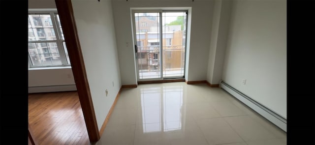 35-19 Leavitt Unit 5H, Flushing, NY 11354 - spare room with a baseboard heating unit, a baseboard radiator, and baseboards