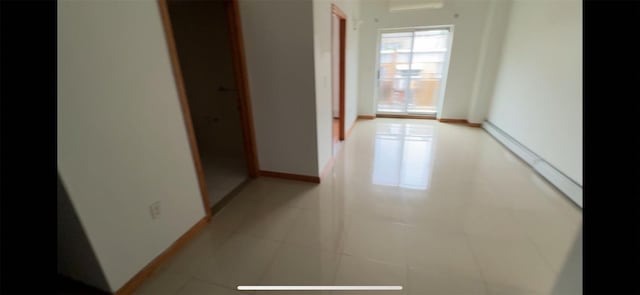 35-19 Leavitt Unit 5H, Flushing, NY 11354 - hall featuring baseboards and light tile patterned flooring