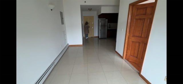 35-19 Leavitt Unit 5H, Flushing, NY 11354 - hall featuring a baseboard radiator, baseboards, and light tile patterned floors