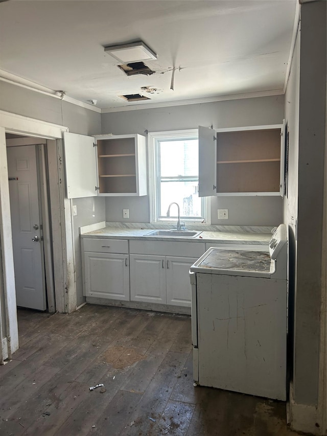 kitchen featuring dark wood-style flooring, stove, a sink, white cabinetry, and open shelves