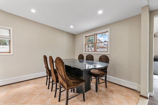 dining space with a baseboard heating unit, plenty of natural light, baseboards, and recessed lighting