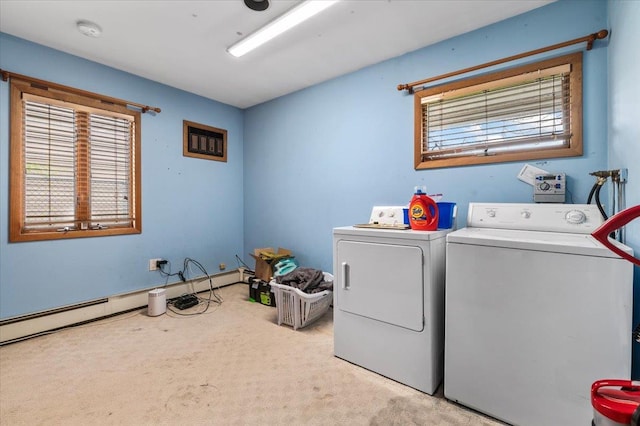 washroom featuring washing machine and dryer and light colored carpet