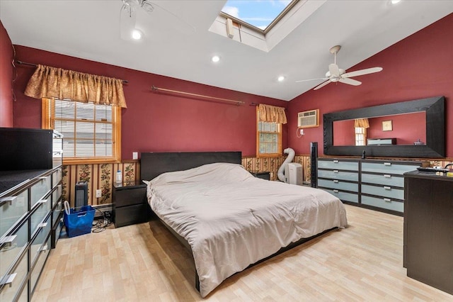 bedroom featuring wood finished floors, vaulted ceiling, multiple windows, recessed lighting, and a wall mounted air conditioner