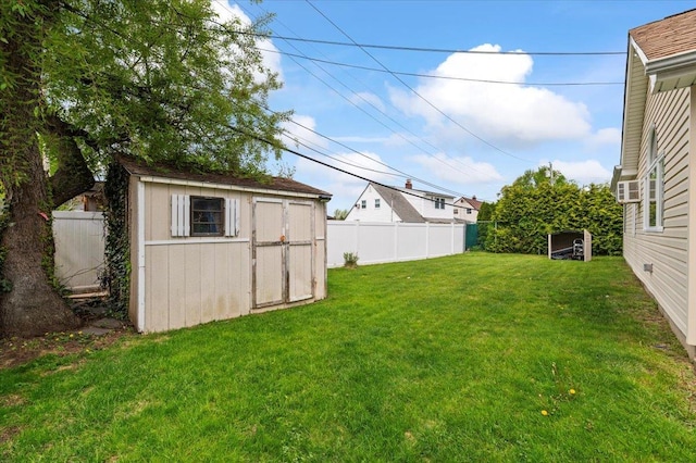 view of yard with a storage unit and an outbuilding