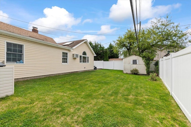 view of yard with an outdoor structure and a shed