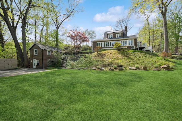 90 Shingle House Rd, Millwood, NY 10546 - view of green lawn with an outbuilding and a deck