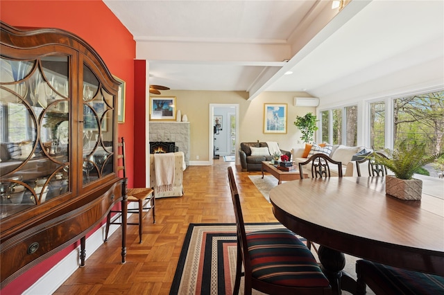 90 Shingle House Rd, Millwood, NY 10546 - dining area featuring baseboards, a fireplace, and a wall mounted air conditioner