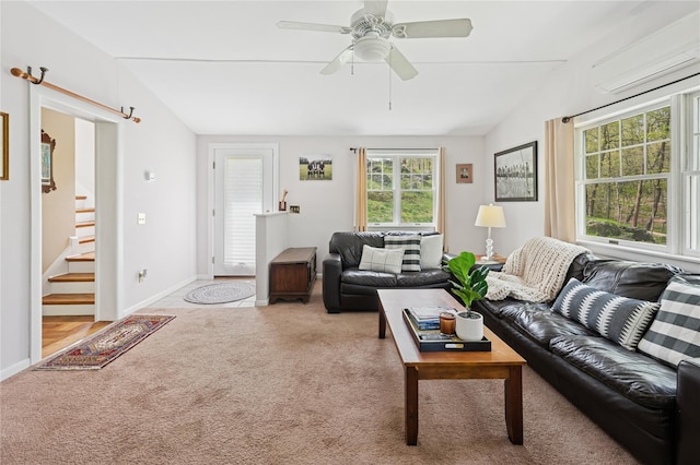 90 Shingle House Rd, Millwood, NY 10546 - carpeted living area featuring a wall unit AC, lofted ceiling, stairway, a ceiling fan, and baseboards