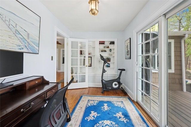 90 Shingle House Rd, Millwood, NY 10546 - workout room with wood finished floors, built in features, and baseboards