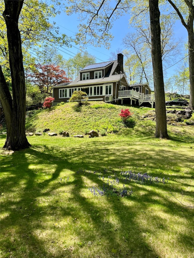 90 Shingle House Rd, Millwood, NY 10546 - view of front of home featuring a chimney, a deck, and a front lawn