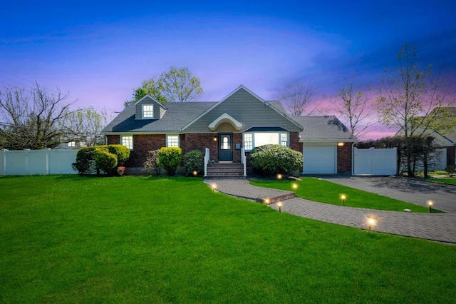 view of front of property featuring driveway, brick siding, and a garage