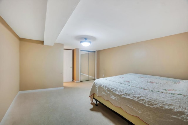carpeted bedroom featuring baseboards