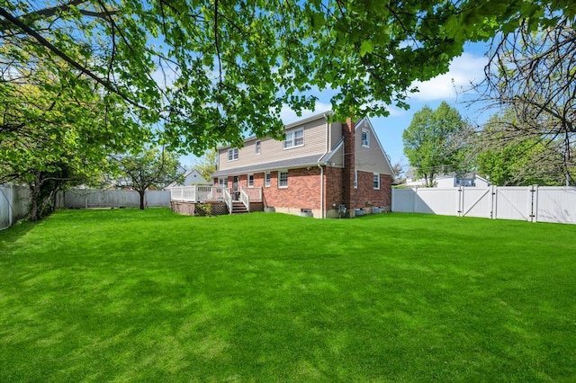 view of yard with a gate and a deck