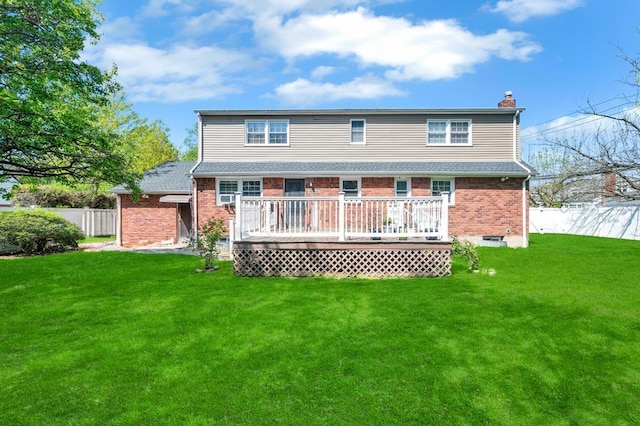 back of property featuring a chimney, brick siding, and a deck