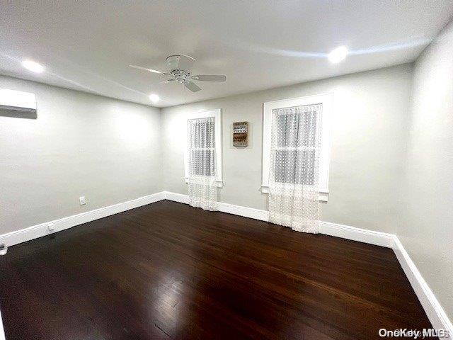 2906 Oceanside Rd, Oceanside, NY 11572 - spare room featuring a ceiling fan, baseboards, dark wood-type flooring, and recessed lighting