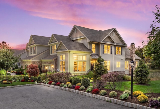 craftsman house featuring stone siding
