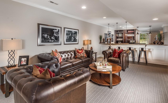 carpeted living room featuring ornamental molding, recessed lighting, and baseboards