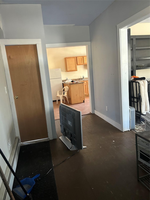 interior space featuring baseboards and baseboard heating