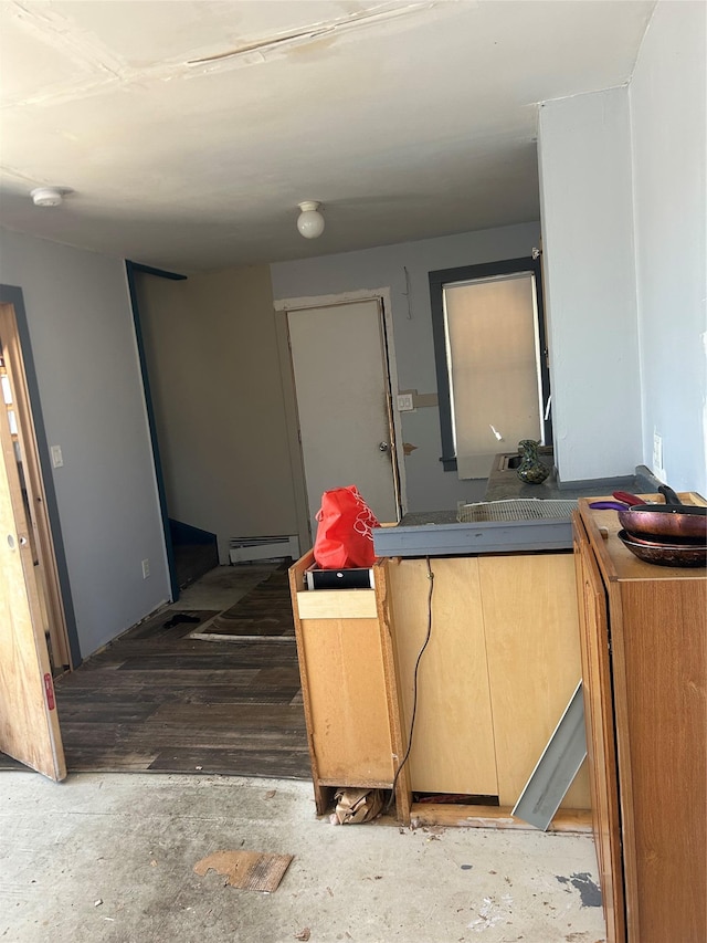 interior space featuring dark countertops and baseboard heating