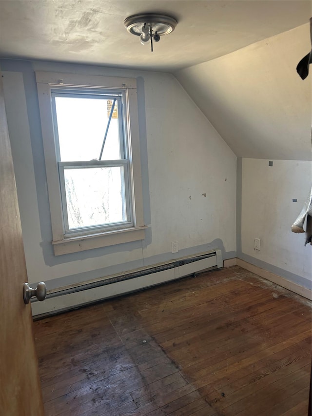 bonus room featuring lofted ceiling, hardwood / wood-style flooring, baseboards, and a baseboard heating unit