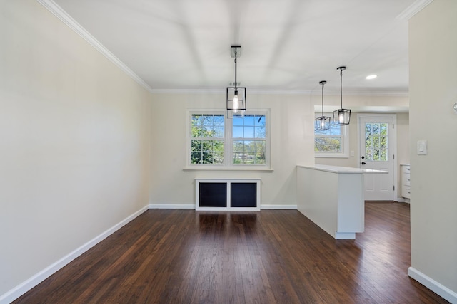 unfurnished dining area with baseboards, ornamental molding, dark wood finished floors, and recessed lighting