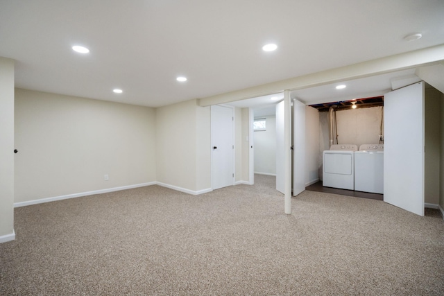 finished basement featuring separate washer and dryer, carpet floors, baseboards, and recessed lighting