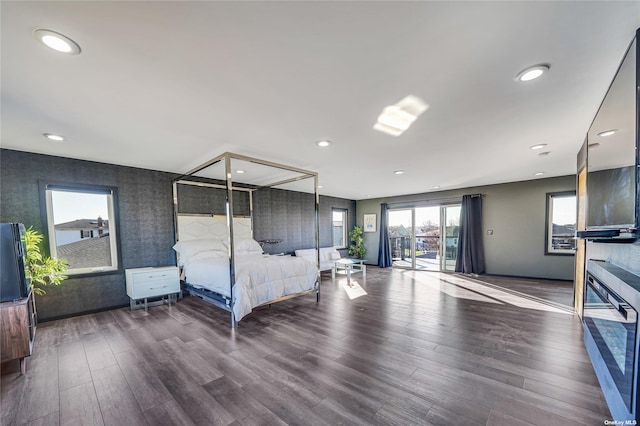 110 Schooner Ln, Copiague, NY 11726 - bedroom with wood finished floors, access to exterior, wallpapered walls, baseboards, and recessed lighting
