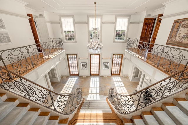 422 Hardscrabble Rd, North Salem, NY 10560 - entryway featuring ornamental molding, stairway, a chandelier, a high ceiling, and baseboards