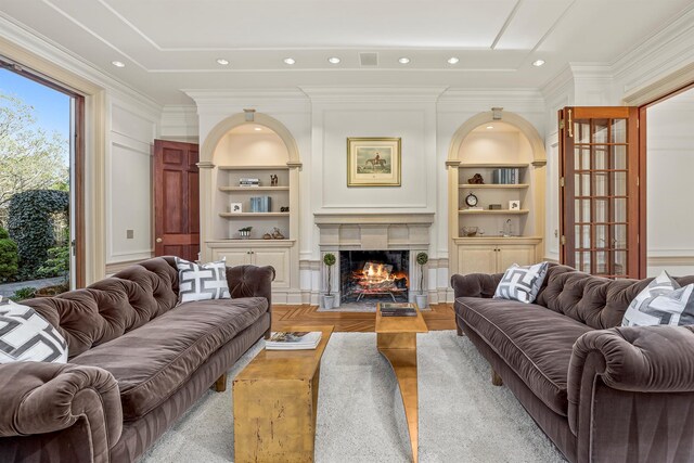 422 Hardscrabble Rd, North Salem, NY 10560 - living room with crown molding, wood finished floors, built in shelves, and a fireplace with flush hearth