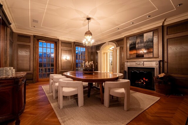 422 Hardscrabble Rd, North Salem, NY 10560 - dining area featuring a warm lit fireplace, decorative columns, crown molding, arched walkways, and a notable chandelier