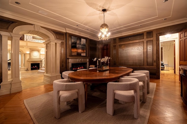 422 Hardscrabble Rd, North Salem, NY 10560 - dining room featuring a notable chandelier, a fireplace, crown molding, and decorative columns