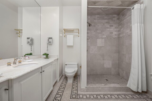 422 Hardscrabble Rd, North Salem, NY 10560 - bathroom with toilet, tiled shower, vanity, and tile patterned flooring