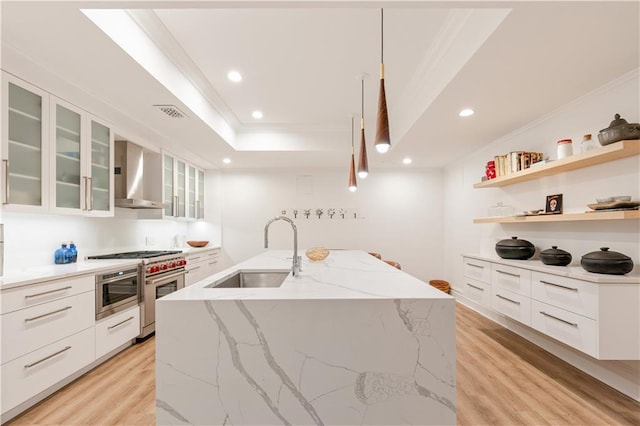 422 Hardscrabble Rd, North Salem, NY 10560 - kitchen featuring a sink, wall chimney range hood, high end stainless steel range, ornamental molding, and light wood finished floors