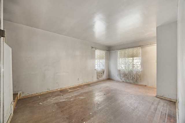spare room featuring wood finished floors
