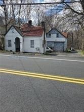 165 S Main St, Pearl River, NY 10965 - view of front facade featuring a chimney