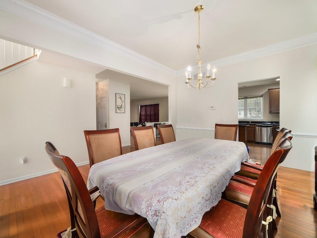 417 Vassar Pl, Fishkill, NY 12524 - dining space featuring crown molding, an inviting chandelier, and light wood finished floors