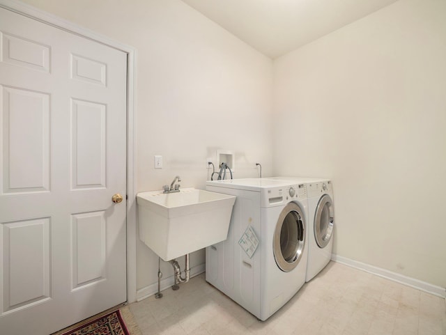 417 Vassar Pl, Fishkill, NY 12524 - laundry area with laundry area, independent washer and dryer, a sink, baseboards, and light floors