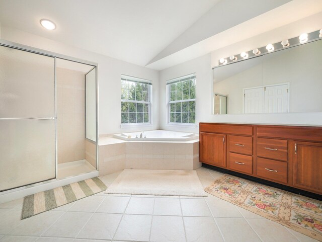 417 Vassar Pl, Fishkill, NY 12524 - full bathroom with vanity, tile patterned floors, vaulted ceiling, a bath, and a stall shower