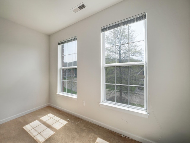 417 Vassar Pl, Fishkill, NY 12524 - unfurnished room featuring visible vents, baseboards, and light colored carpet