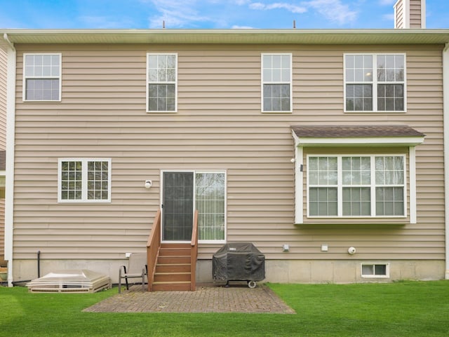 417 Vassar Pl, Fishkill, NY 12524 - back of property with entry steps, a patio, a chimney, and a lawn