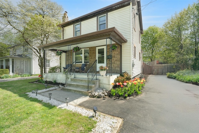 67 Arnett Rd, Rhinebeck, NY 12572 - traditional-style home featuring a porch and a chimney