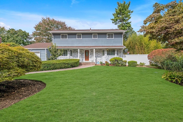 66 Rockland Dr, Jericho, NY 11753 - view of front of property featuring an attached garage, stone siding, and a porch