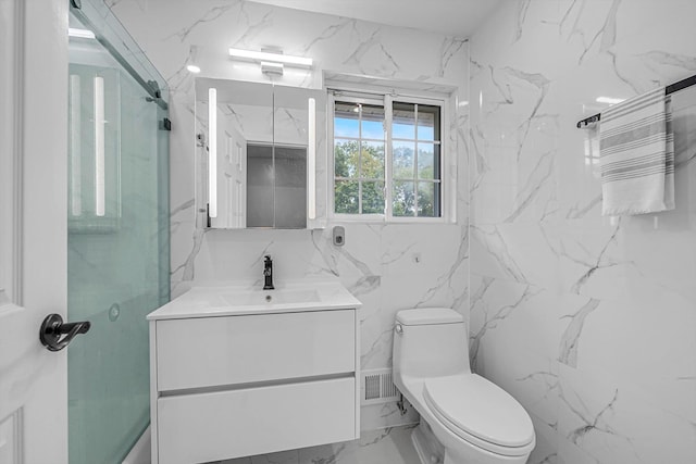 66 Rockland Dr, Jericho, NY 11753 - bathroom featuring vanity, marble finish flooring, toilet, and a shower