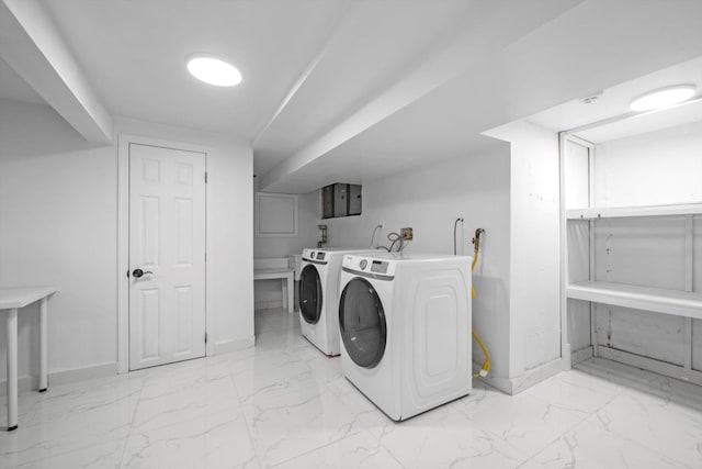 66 Rockland Dr, Jericho, NY 11753 - laundry room with independent washer and dryer, baseboards, and light marble finish flooring