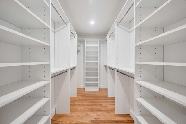 walk in closet featuring light wood-style flooring