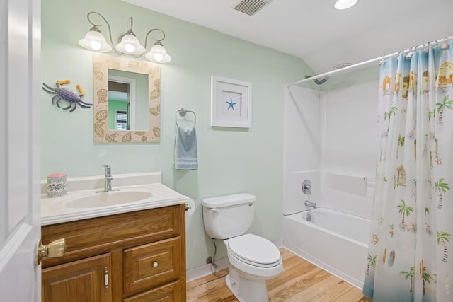 143 Tuthill Rd, Montauk, NY 11954 - full bath featuring toilet, wood finished floors, shower / tub combo with curtain, visible vents, and vanity