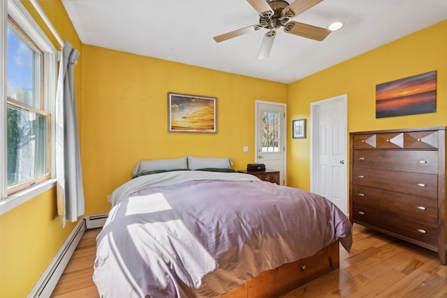 143 Tuthill Rd, Montauk, NY 11954 - bedroom featuring a ceiling fan, light wood-type flooring, and baseboard heating